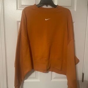 Nike Women's Bold Orange Crew Neck Sweater, oversized and cropped.